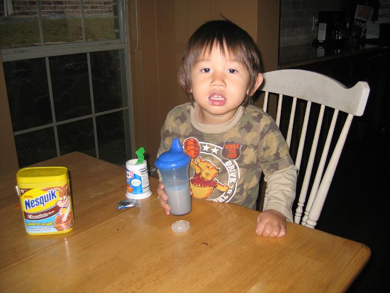 February16Hail 005.jpg - Lukas and a piece of hail from the storm - February 16